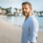 man standing on beach during daytime